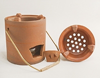 Печь из исинкой глины для подогрева чайника на углях